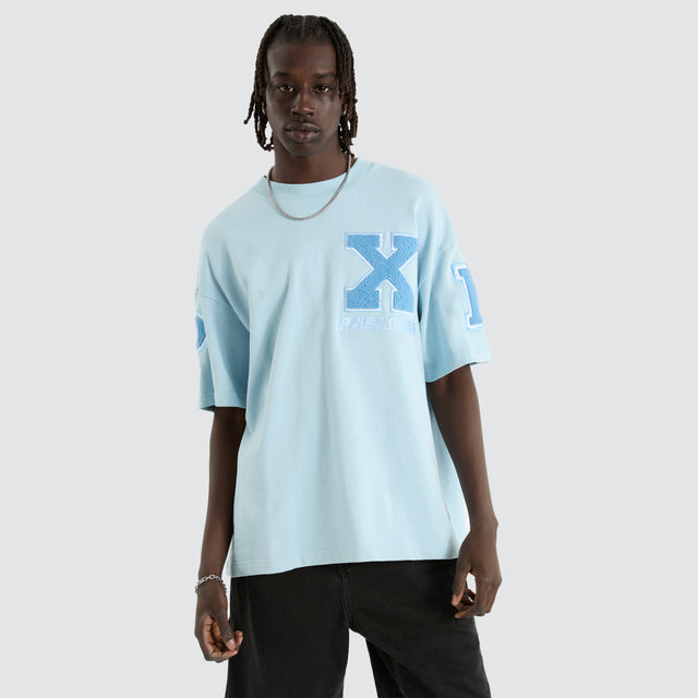 Model Wears Big X Loopback Raptor Tee Baby Blue T-Shirts in Blue - Image 2