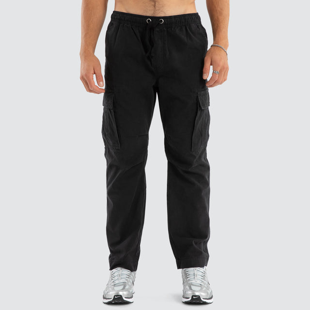 Model Wears League Cargo Pant Black Pants in Black - Image 3