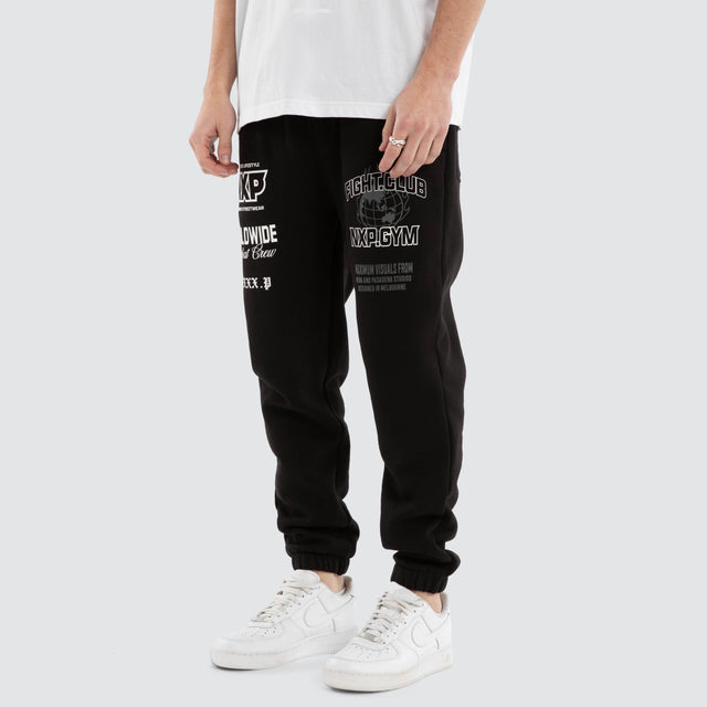 Model Wears Forge Gym Trackpant Jet Black Trackpants in Black - Image 1