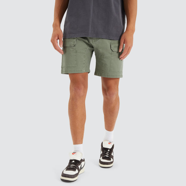 Model Wears F100 Fine Twill Short Khaki Shorts in Green - Image 1