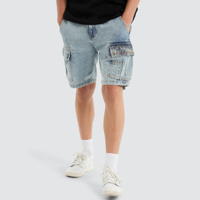 Model Wears Colby Denim Cargo Short Herring Blue Shorts in Blue - Image 1