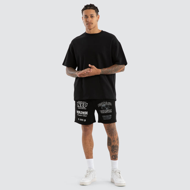 Model Wears Forge Gym Trackshort Jet Black Shorts in Black - Image 2