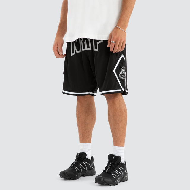 Model wears Court Basketball Short Jet Black Shorts in Black - Image 1