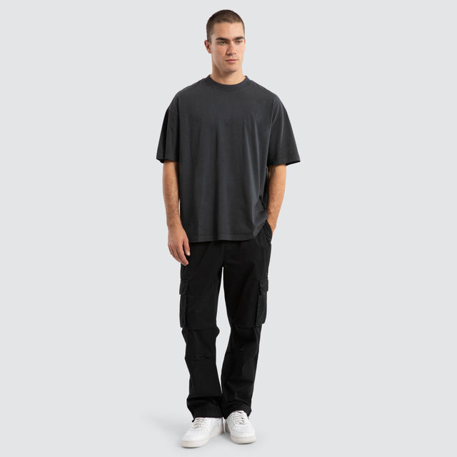 Model Wears P350 Parachute Cargo Pant Jet Black Pants in Black - Image 2