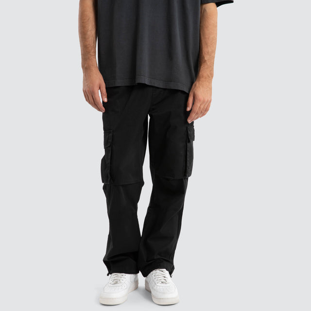 Model Wears P350 Parachute Cargo Pant Jet Black Pants in Black - Image 1
