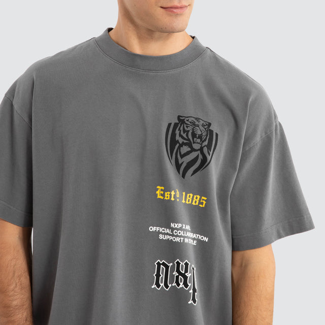 Model Wears Richmond Tigers AFL Stack Tee Pigment Charcoal T-Shirts in Grey - Image 6