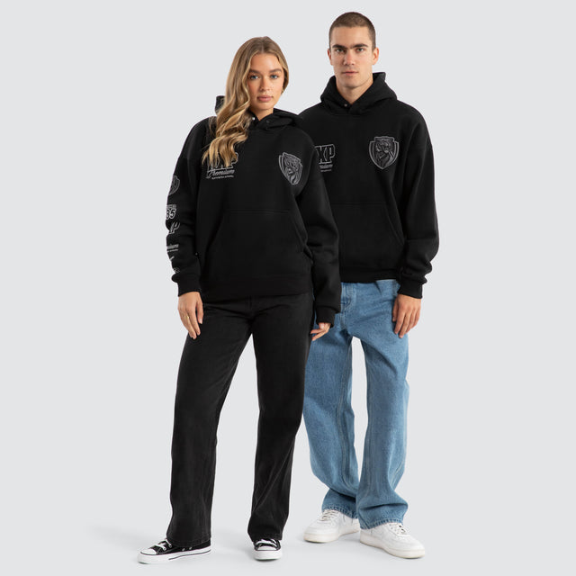 Model Wears Richmond Tigers AFL Mono Hoodie Jet Black Hoodies in Black - Image 3