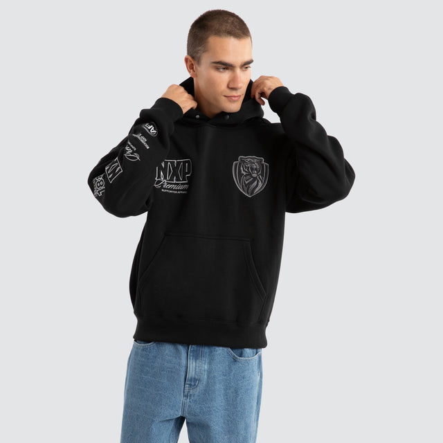 Model Wears Richmond Tigers AFL Mono Hoodie Jet Black Hoodies in Black - Image 5