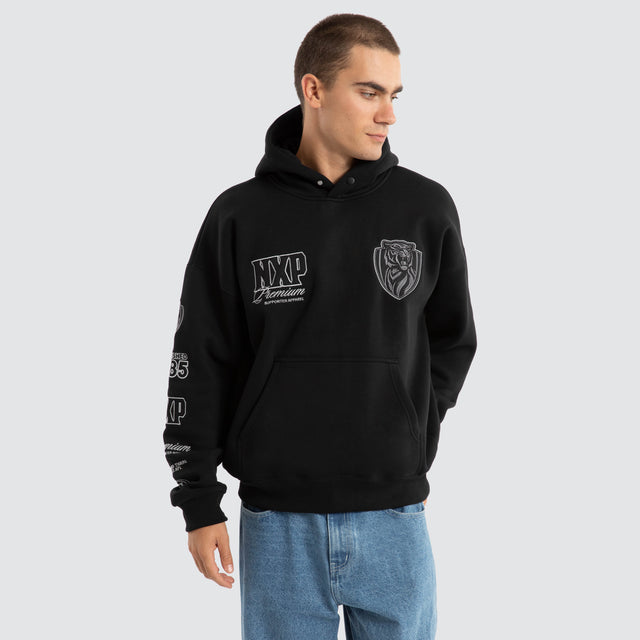 Model Wears Richmond Tigers AFL Mono Hoodie Jet Black Hoodies in Black - Image 2
