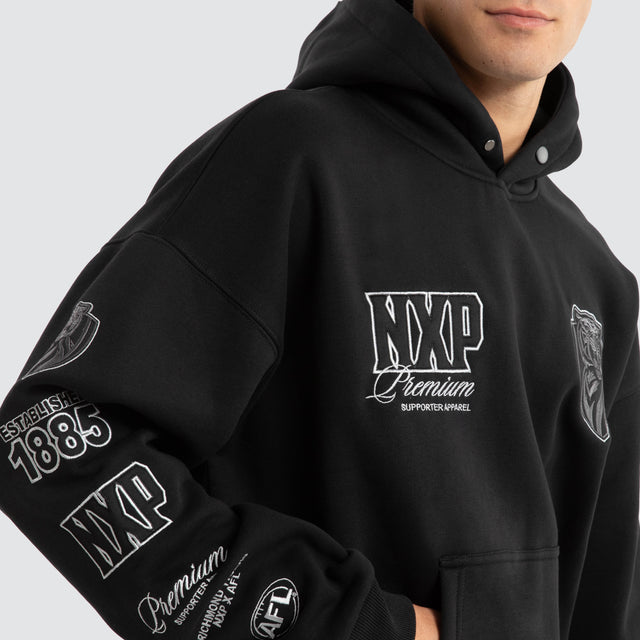 Model Wears Richmond Tigers AFL Mono Hoodie Jet Black Hoodies in Black - Image 6