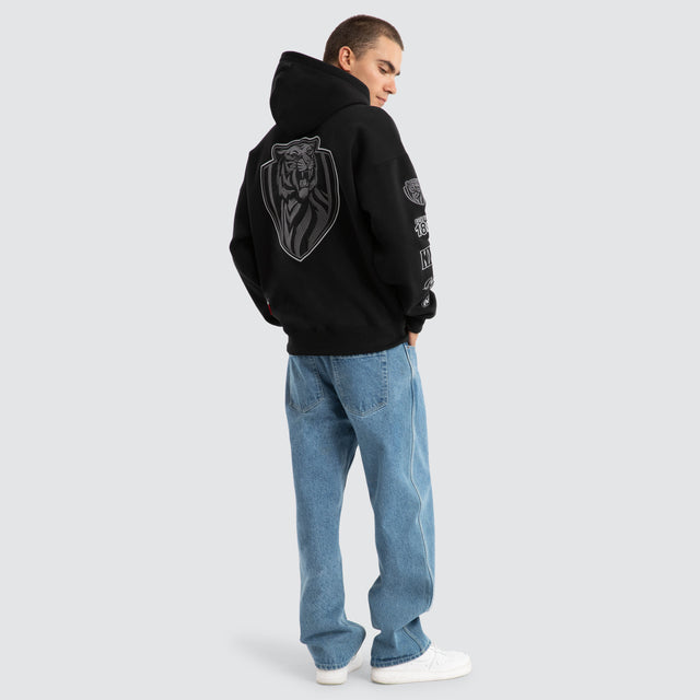 Model Wears Richmond Tigers AFL Mono Hoodie Jet Black Hoodies in Black - Image 7