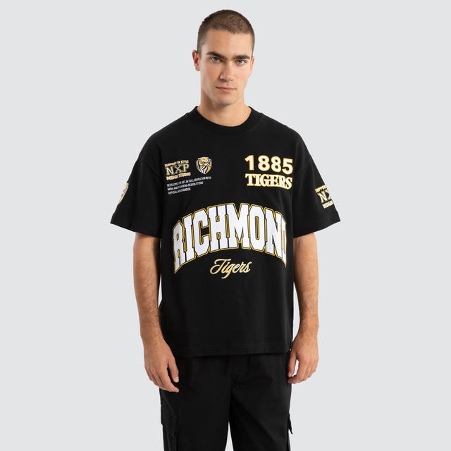 Model Wears Richmond Tigers AFL Academy Tee Jet Black T-Shirts in Black - Image 1