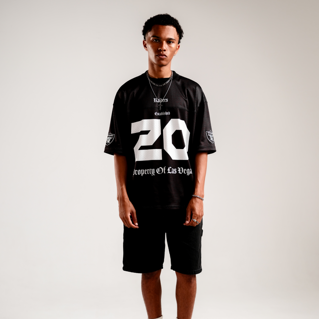 Model Wears Las Vegas Raiders NFL Mesh Jersey Tee Jet Black T-Shirts in Black - Image 2