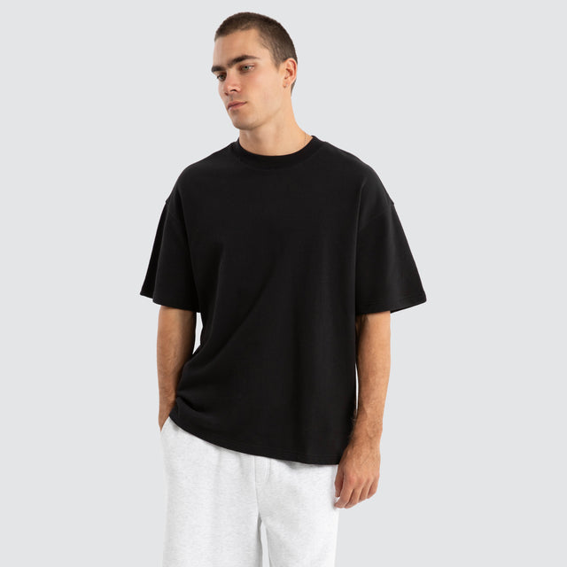 Model Wears Supply Loopback Raptor Tee Jet Black T-Shirts in Black - Image 1