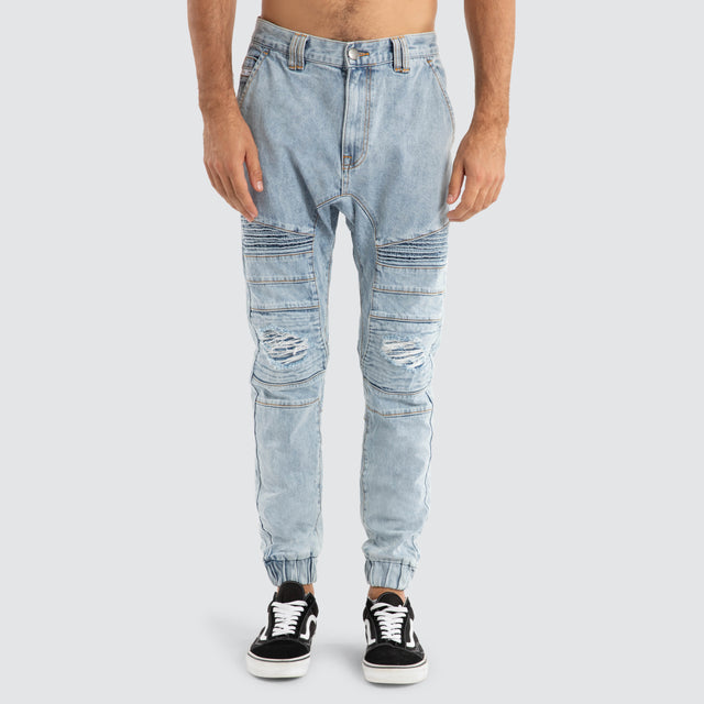 Model Wears Viper Denim Jogger Portland Blue Pants in Blue - Image 6