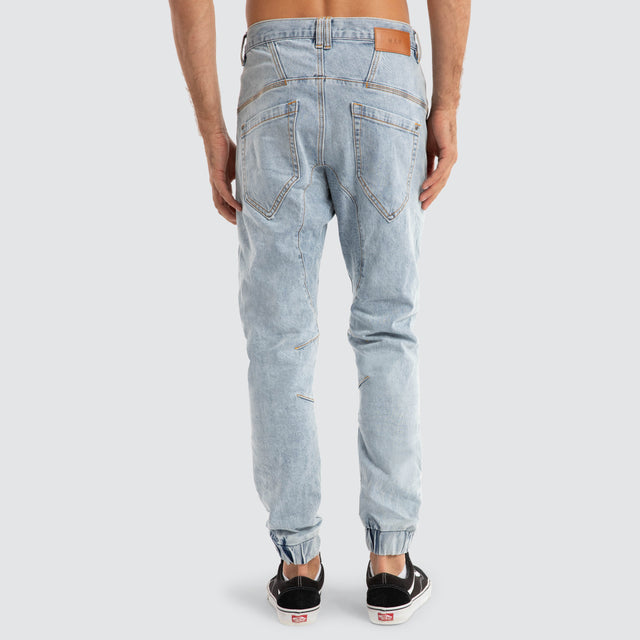 Model Wears Viper Denim Jogger Portland Blue Pants in Blue - Image 7