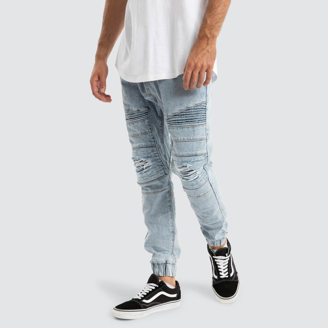 Model Wears Viper Denim Jogger Portland Blue Pants in Blue - Image 3