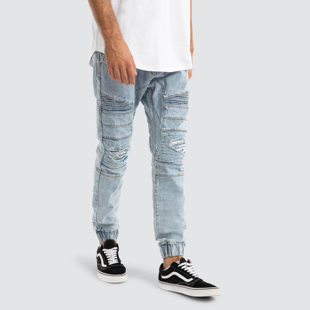 Model Wears Viper Denim Jogger Portland Blue Pants in Blue - Image 4
