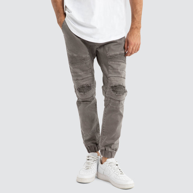 Model Wears Viper Denim Jogger Volcano Pants in Black - Image 1