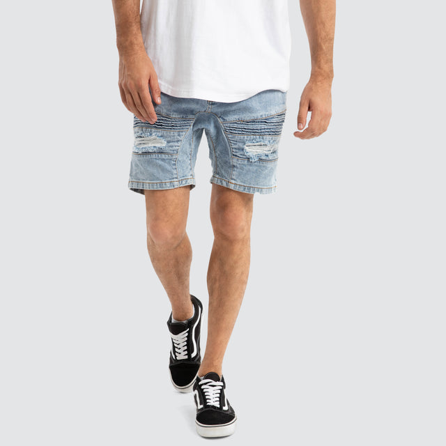 Model Wears Viper Denim Short Portland Blue Shorts in Blue - Image 1