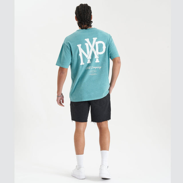 Model Wears Academy Heavy Box Fit Tee Pigment Teal T-Shirts in Teal - Image 5