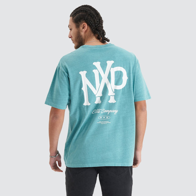 Model Wears Academy Heavy Box Fit Tee Pigment Teal T-Shirts in Teal - Image 1