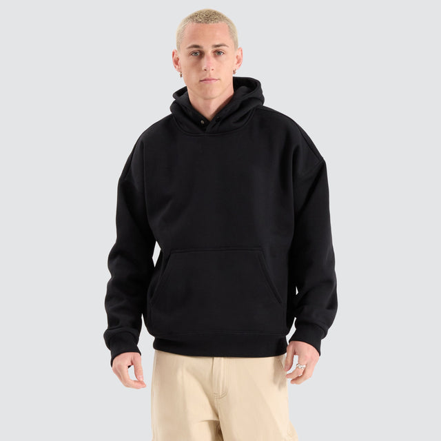 Model Wears Airdrie Box Fit Hoodie Jet Black Hoodies in Black - Image 1