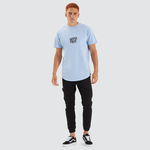 Model Wears Anode Dual Curved Tee Pigment Placid Blue T-Shirts in Blue - Image 4
