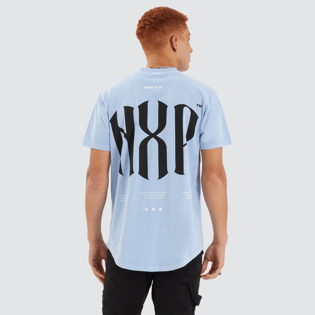 Model Wears Anode Dual Curved Tee Pigment Placid Blue T-Shirts in Blue - Image 2