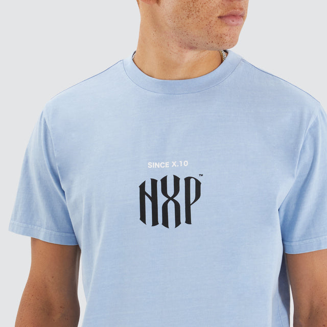 Model Wears Anode Dual Curved Tee Pigment Placid Blue T-Shirts in Blue - Image 3