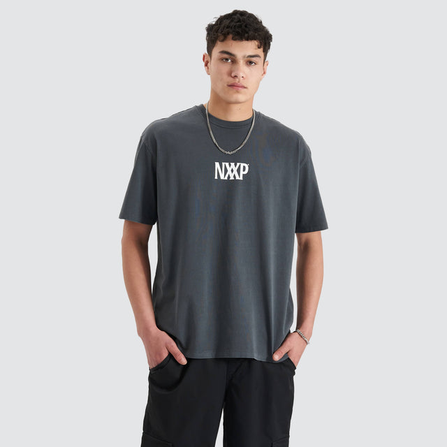 Model Wears Arctic Heavy Box Fit Tee Pigment Asphalt T-Shirts in Grey - Image 2