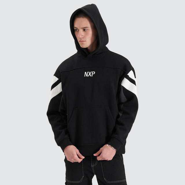 Model Wears Atrium Heavy Box Fit Hoodie Jet Black Jumpers in Black - Image 1