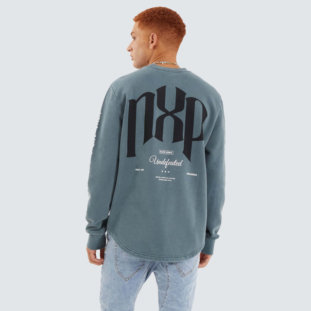 Model Wears Axis Dual Curved Sweater Pigment Stormy Weather Jumpers in Grey - Image 1