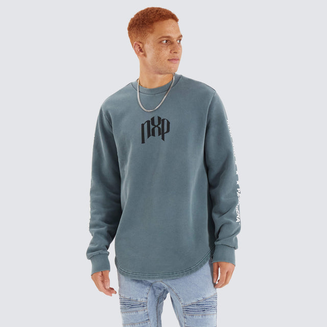 Model Wears Axis Dual Curved Sweater Pigment Stormy Weather Jumpers in Grey - Image 3
