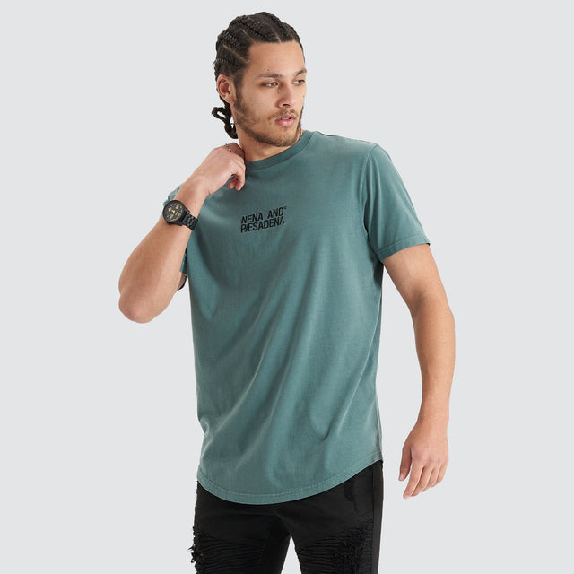 Model Wears Blockade Dual Curved Tee Pigment Silver Pine T-Shirts in Green - Image 4