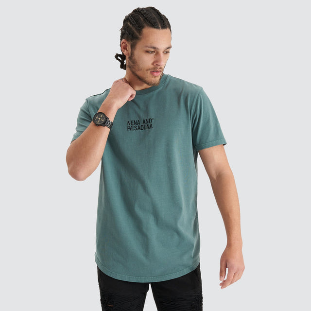 Model Wears Blockade Dual Curved Tee Pigment Silver Pine T-Shirts in Green - Image 1