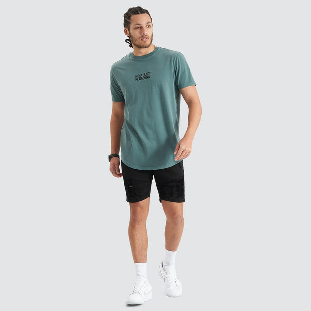 Model Wears Blockade Dual Curved Tee Pigment Silver Pine T-Shirts in Green - Image 2