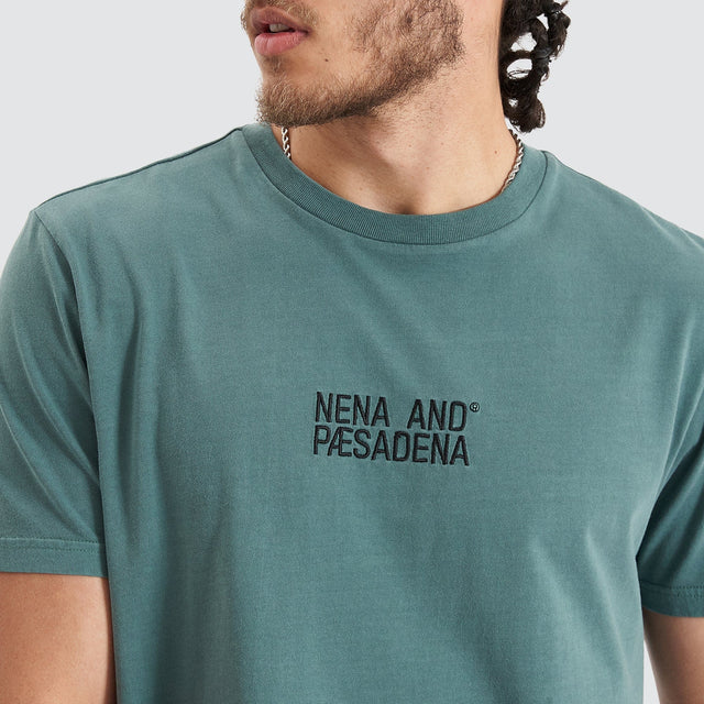 Model Wears Blockade Dual Curved Tee Pigment Silver Pine T-Shirts in Green - Image 3