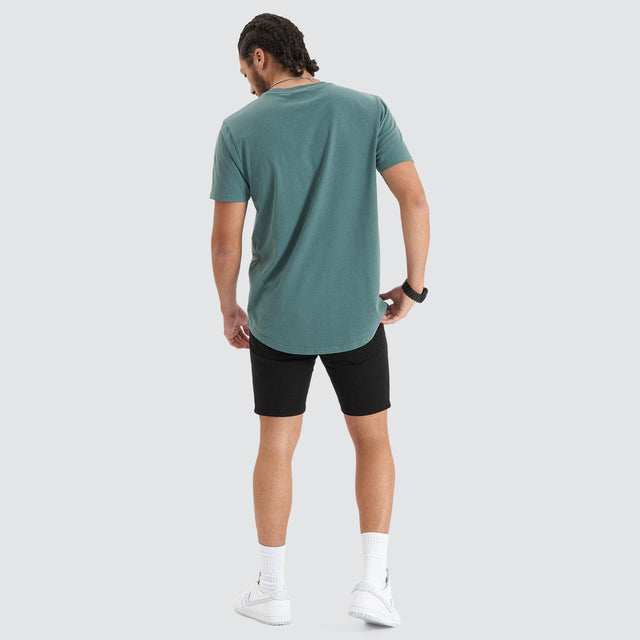 Model Wears Blockade Dual Curved Tee Pigment Silver Pine T-Shirts in Green - Image 5