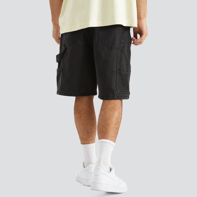 Model Wears Built Carpenter Short Black Shorts in Black - Image 2