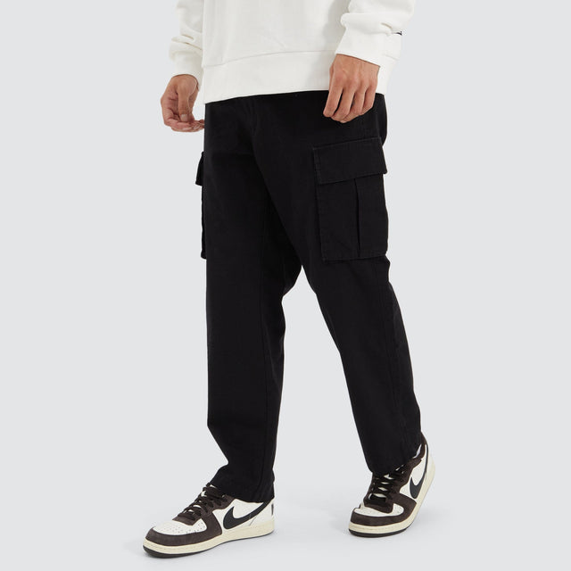 Model Wears C300 Ripstop Cargo Pant Black Pants in Black - Image 1