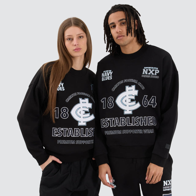 Model Wears Carlton Blues AFL Box Fit Sweater Jet Black Jumpers in Black - Image 2