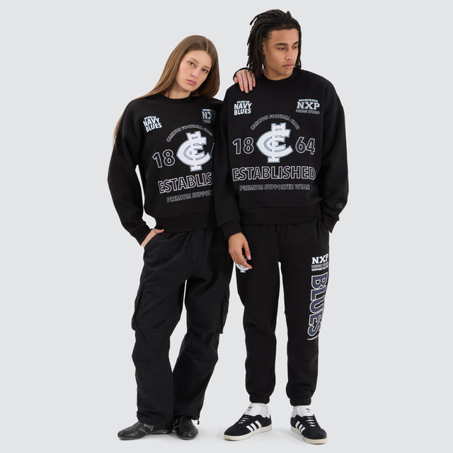 Model Wears Carlton Blues AFL Box Fit Sweater Jet Black Jumpers in Black - Image 5