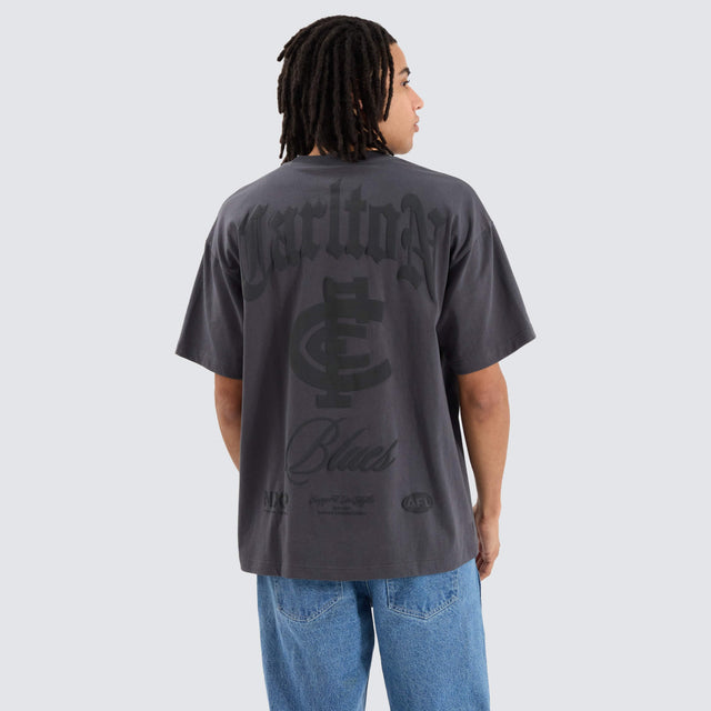Model Wears Carlton Blues AFL Heavy Raptor Tee Asphalt T-Shirts in Grey - Image 1