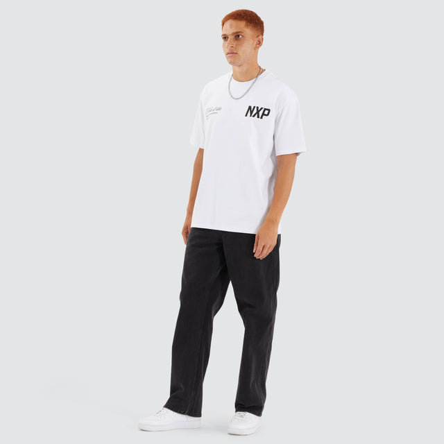 Model Wears Central Box Fit Tee Optical White T-Shirts in White - Image 4