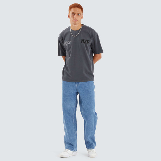 Model Wears Central Box Fit Tee Pigment Asphalt T-Shirts in Grey - Image 4