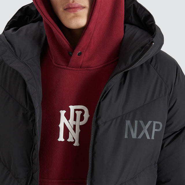 Model Wears Chrysler Raglan Puffer Jacket Jet Black Jackets in Black - Image 2