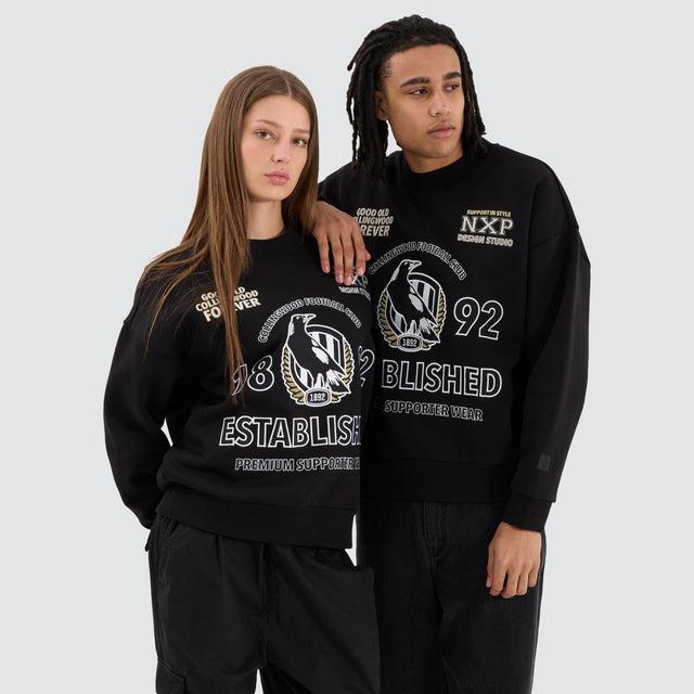 Model Wears Collingwood Magpies AFL Box Fit Sweater Jet Black Jumpers in Black - Image 3