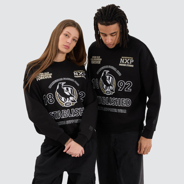 Model Wears Collingwood Magpies AFL Box Fit Sweater Jet Black Jumpers in Black - Image 6