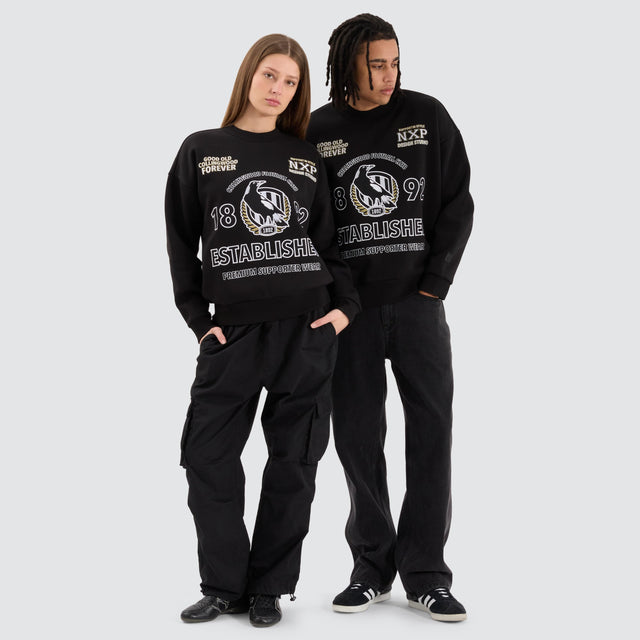 Model Wears Collingwood Magpies AFL Box Fit Sweater Jet Black Jumpers in Black - Image 5